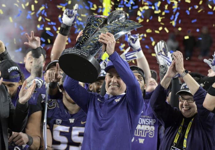 Nov 30, 2018; Santa Clara, CA, USA; Washington Huskies head coach Chris Petersen hoists the championship trophy after the 2018 Pac-12 Championship against the Utah Utes at Levi's Stadium. Washington defeated Utah 10-3. Mandatory Credit: Kirby Lee-USA TODAY Sports